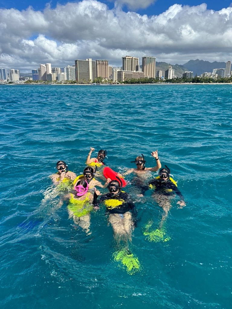  Guests snorkeling in Honolulu under the guidance of Hawaii Ocean Charters.