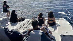 Tourists enjoying Oahu boat tours with Hawaii Ocean Charters.