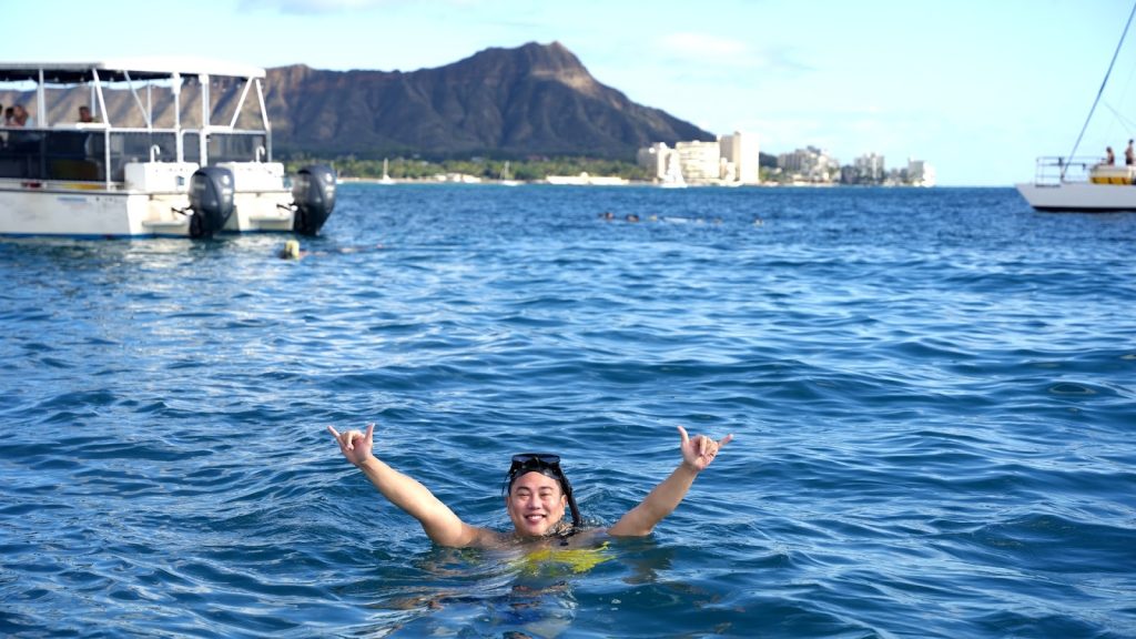 Man posing after a successful snorkeling session. 