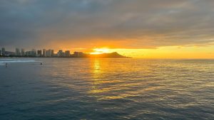 A view of the ocean in Oahu during sunrise.