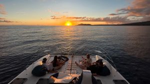 Guests on a boat in Oahu, Hawaii enjoying a scenic ocean view.
