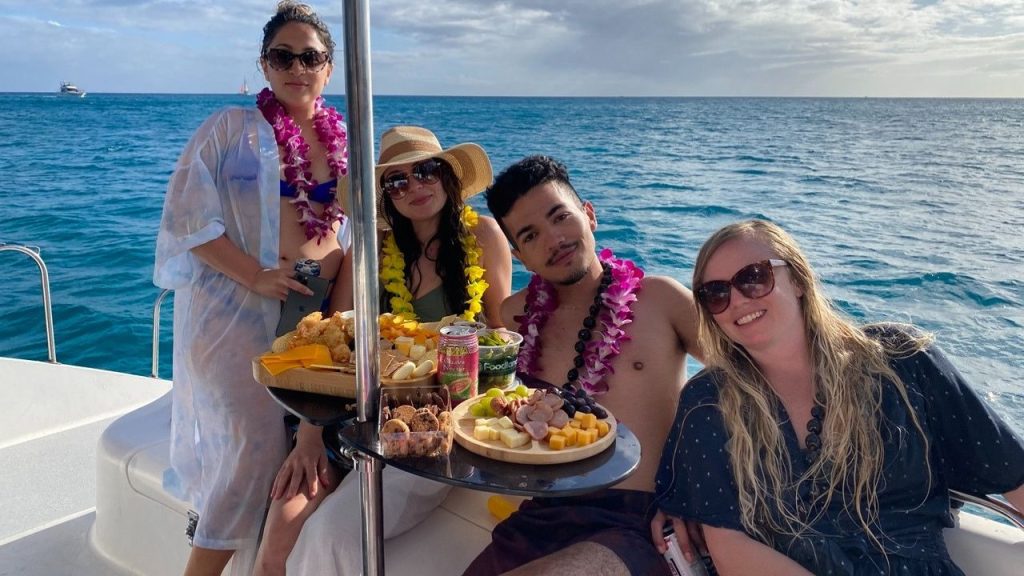 Guests having a good time on a boat in Waikiki, Honolulu
