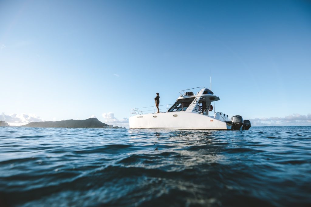 Boat moving on the ocean showing waves and motion. 
