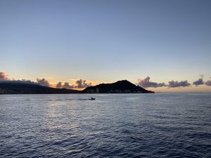 A moment captured just before sunrise from a boat in Oahu.