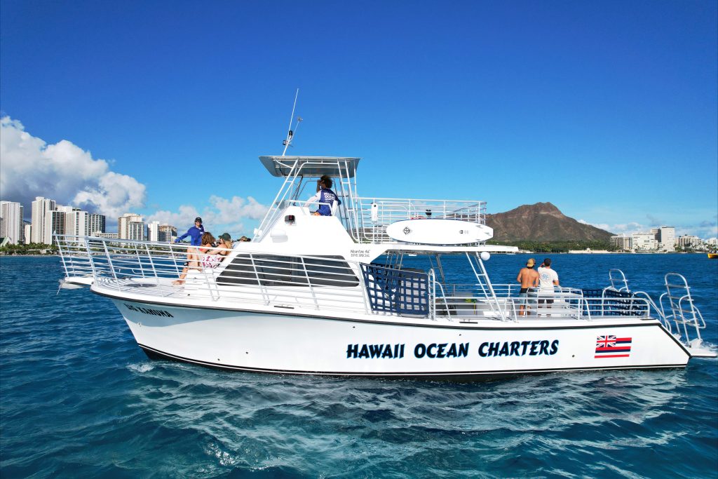 Group of people enjoying a lively Waikiki boat cruise.