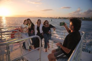 Group enjoying a sunset boat tour in Hawaii. (1)
