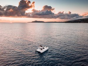 Sunset cruise boat sailing along the Oahu coastline near Waikiki.