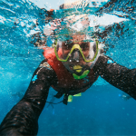 Close-up selfie of a snorkeler underwater