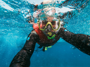 Close-up selfie of a snorkeler underwater