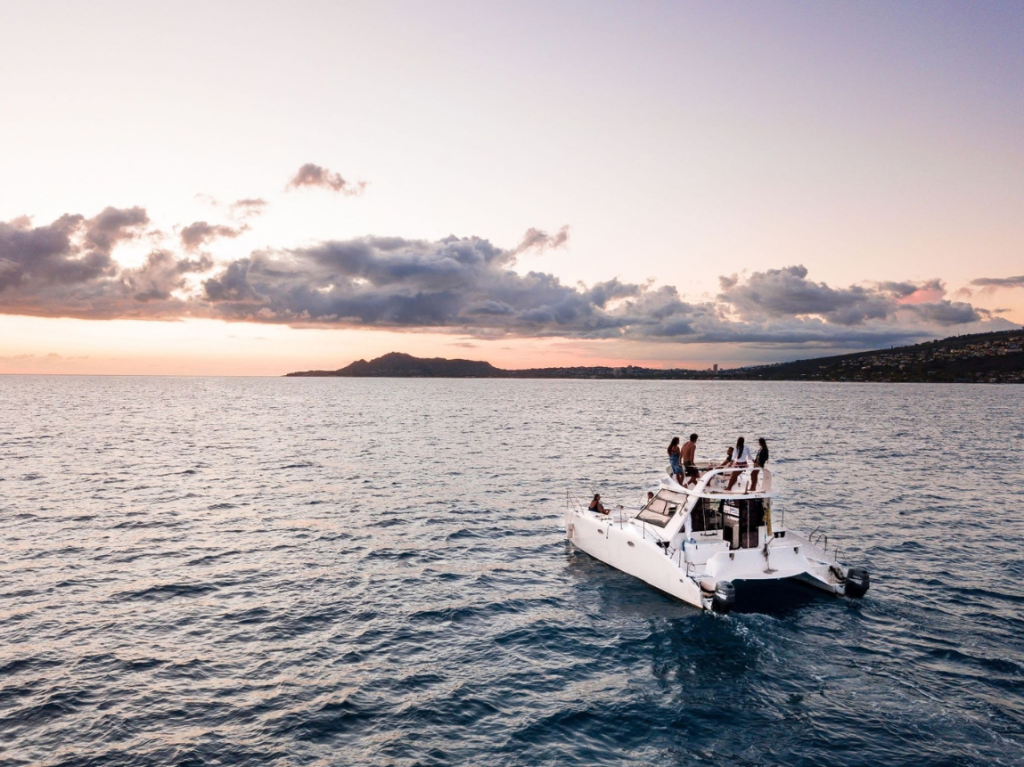 Waikiki sunset cruise with Diamond Head in the background.