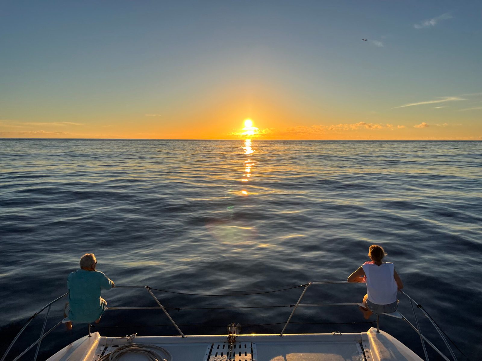 A man sitting in a boat on a body of water