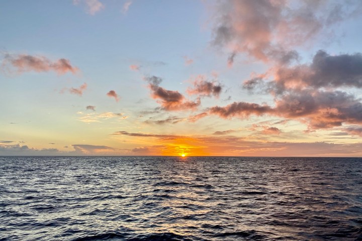 a sunset over a body of water